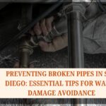 Plumber fixing a broken pipe in a flooded San Diego home – Broken Pipe Water Cleanup San Diego