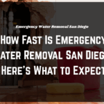 Flooded living room undergoing emergency water removal San Diego